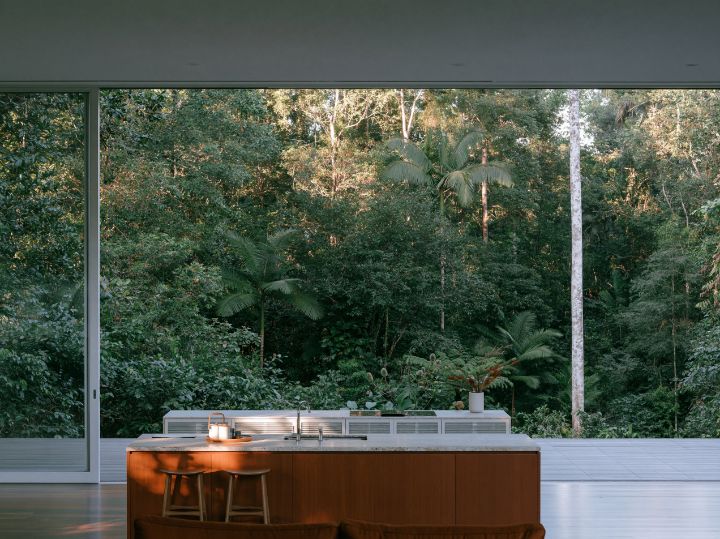 A kitchen that opens onto the deck through one wide door