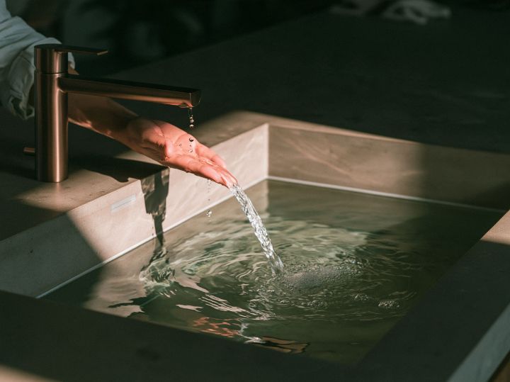 A stone basin, water and morning light