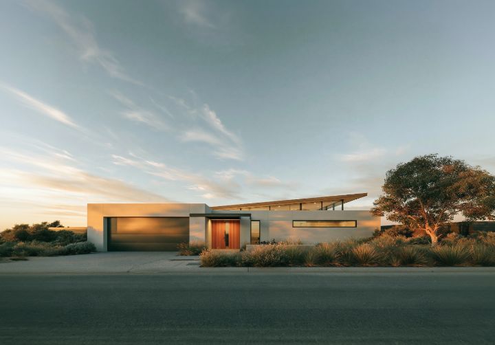 A low skillion over pale render, the garage tucked to one side